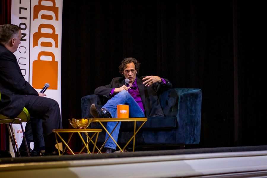 Dr. Payne in conversation with an interviewer on stage